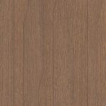 Detailafbeelding van decoratief plaatmateriaal met een dynamisch lijnenspel in een warm bruin eikenhout decor, de S220 Doga van Cleaf.